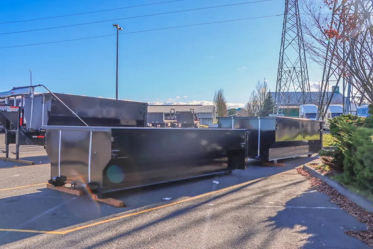 Roll-off dumpster ready for waste disposal at job site for 2 Yard Dumpster Rental in Seaside